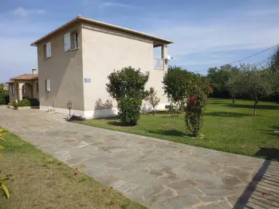 a house with a stone driveway in front of it at Bed and Breakfast in LʼArena