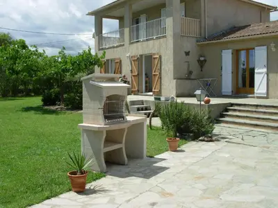 a house with a outdoor oven in the yard at Bed and Breakfast in LʼArena