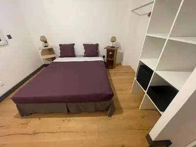 a bedroom with a bed and a book shelf at Villa de luxe Piscine 5 chambre in Vescovato