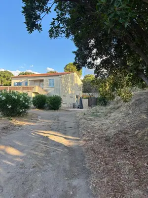 an empty road in front of a house at Bella Suare in Calenzana