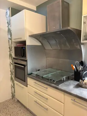 a kitchen with a stove top oven in a kitchen at Bella Suare in Calenzana