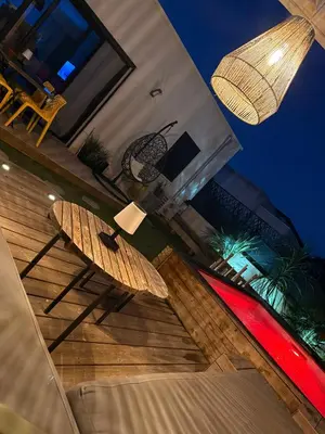 a pair of surfboards sitting on top of a house at Villa Maria in Borgo