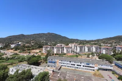 an aerial view of a city with buildings at Spacieux Appartement Vue Mer et Montagne en dernier étage avec Terrasse - Parking et Wifi in Ajaccio