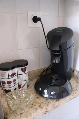 a coffee maker sitting on a counter in a kitchen at Spacieux Appartement Vue Mer et Montagne en dernier étage avec Terrasse - Parking et Wifi in Ajaccio