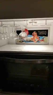a refrigerator with a picture of a woman on it at Bergerie Restaurée in Corte