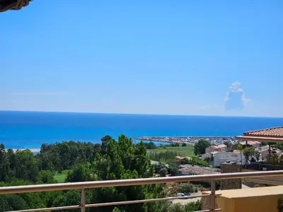 a view of the ocean from a balcony at Appartement Paolina Vue Mer Sari-Solenzara Corse in Sari Solenzara