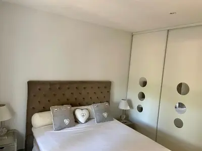 a bedroom with a bed with two pillows at La Milange de Porto vecchio in Porto-Vecchio
