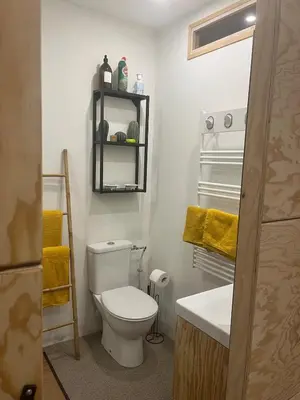 a bathroom with a white toilet and a sink at Eden Studio in Ajaccio