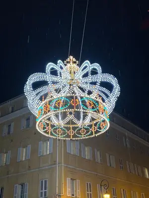 a large christmas light hanging from a building at Eden Studio in Ajaccio