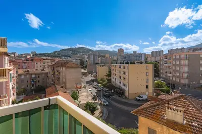 a view of a city from a balcony at Azur Ajaccien - Proche du port avec parking in Ajaccio