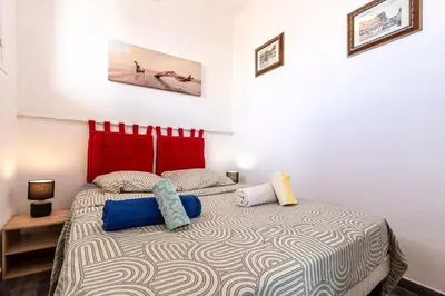 a bedroom with a bed with two pillows on it at Azur Ajaccien - Proche du port avec parking in Ajaccio