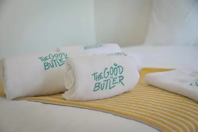 a bed with three pillows that say the good bunker at Helena - Bright 2Br Trottel Beach by foot - by TGB in Ajaccio