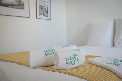 a bedroom with a bed with towels on it at Helena - Bright 2Br Trottel Beach by foot - by TGB in Ajaccio