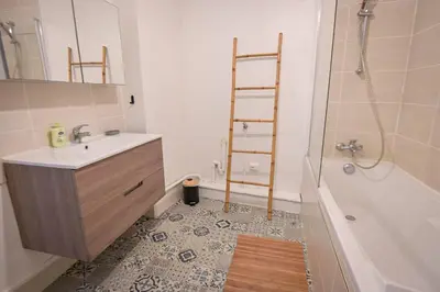 a bathroom with a sink and a shower and a ladder at Helena - Bright 2Br Trottel Beach by foot - by TGB in Ajaccio