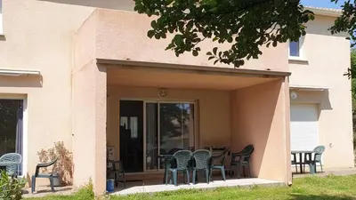 a patio with chairs and a table on a porch at Casa di u sole in Santa-Maria-Poggio