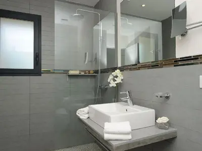 a bathroom with a sink and a mirror at Clos Simoni in Figari