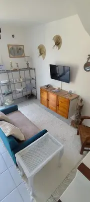 a living room with a couch and a tv at Casa Di l'alba in Borgo