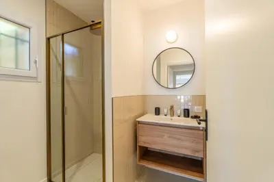 a bathroom with a sink and a shower at Villa Rossa in Lecci
