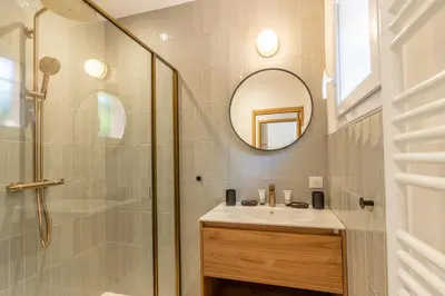 a bathroom with a shower and a sink and a mirror at Villa Rossa in Lecci
