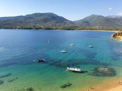 a group of boats in a large body of water at propriano pieds dans l eau in Propriano