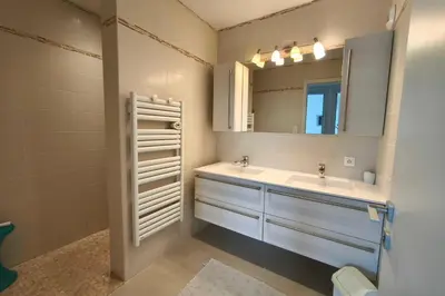a bedroom with two bunk beds and a balcony at Apartment with terrace close to the beach in Grosseto-Prugna