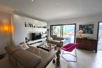 a living room with a couch and a table at Apartment with terrace close to the beach in Grosseto-Prugna
