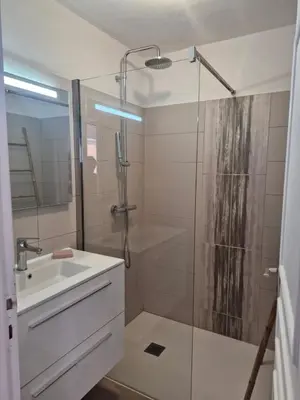a bathroom with a shower and a sink at Les Terrasses du Levant in Porto-Vecchio