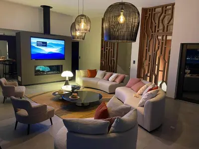 a living room with two couches and a tv at Villa Clémentines Porticcio in Grosseto-Prugna