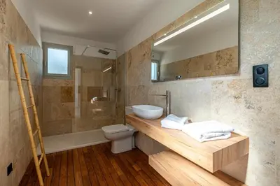 a bathroom with a sink and a toilet and a shower at Le Roc - 1er étage - Splendide Vue Mer in Coti-Chiavari