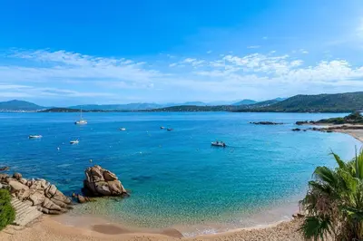 a view of a beach with boats in the water at Le Roc - RDC - Splendide Vue Mer in Coti-Chiavari