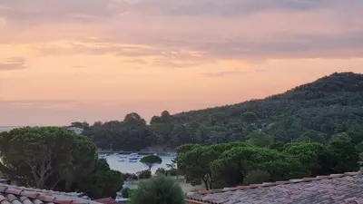 a view of a river with boats in the water at Appartement Carpe diem vue mer plage à pied in Conca