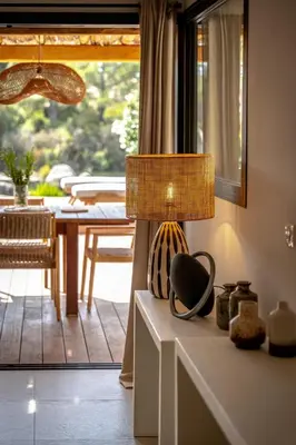 a lamp sitting on top of a table in a room at Villa Sempietru, 8 pers, lagon & plage à pied in Lecci