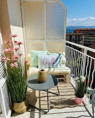 a living room with a couch and a table at Le Romane- appartement T2 proche centre-ville et parking gratuit in Ajaccio