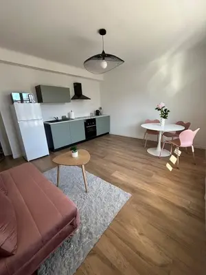 an open door with a view of a balcony at Le Romane- appartement T2 proche centre-ville et parking gratuit in Ajaccio