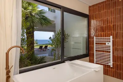 a bathroom with a sink and a large window at Balamb Garden A Rinascita in Ajaccio