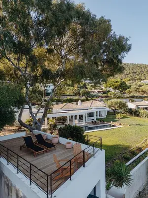 a view of a house with a deck and chairs at Balamb Garden A Rinascita in Ajaccio