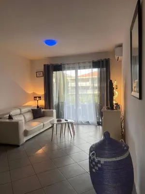 a living room with a couch and a table at CORSE RESIDENCE COSTA D'ORO Folelli F2 in Penta-di-Casinca