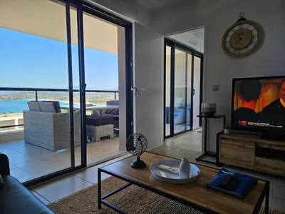 a living room with a view of the ocean at 1vue,1 lieu, Des vacances in Pietrosella