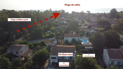 an aerial view of a house in a neighborhood with a red triangle at La parenthèse in Lucciana