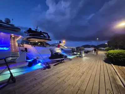 a group of boats parked on a dock at night at T2 Port de Porto Vecchio 4 pers vue Montagne in Porto-Vecchio