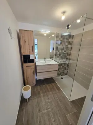a bathroom with a toilet and a sink and a shower at Chez Corinne et Paul classé 3 Etoiles in Propriano