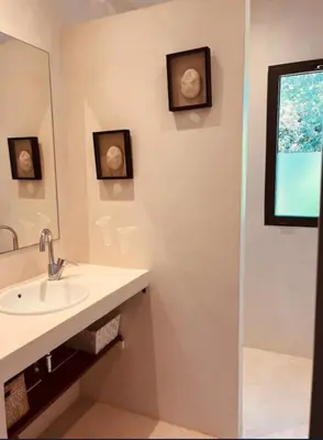 a bathroom with a sink and a mirror and a shower at Peaceful Villa Between Sea And Mountain In Corsica in Lecci