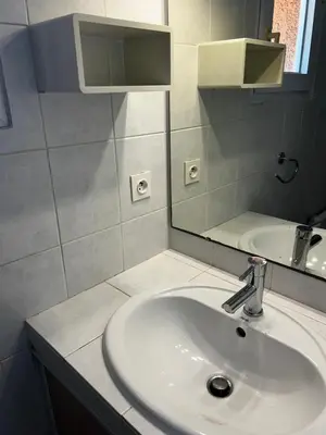 a bathroom with a sink and a mirror at Mini villa Corse du sud Residence U Re D Alzetu in Lecci