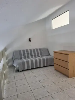 an empty room with a dresser and a door at Saint Cyprien, Corse du Sud - Mini Villa - 6 couchages in Lecci