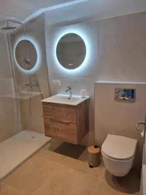 a shower with a glass door in a bathroom at Saint Cyprien, Corse du Sud - Mini Villa - 6 couchages in Lecci