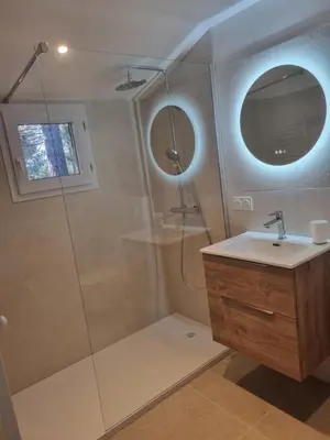 a bathroom with a sink and a mirror at Saint Cyprien, Corse du Sud - Mini Villa - 6 couchages in Lecci
