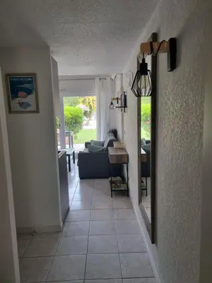 a hallway leading to a living room with a couch at Saint Cyprien, Corse du Sud - Mini Villa - 6 couchages in Lecci