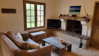 a living room with a couch and a fireplace at Casa di Sognu in Porto-Vecchio