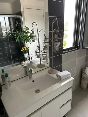 a bathroom with a sink and a mirror at Porticcio in Grosseto-Prugna