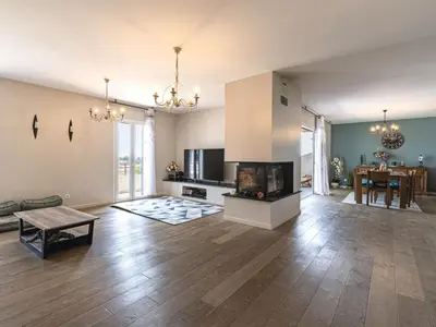 a large living room with a fireplace and a couch at Apartment La vallée by Interhome in Aléria